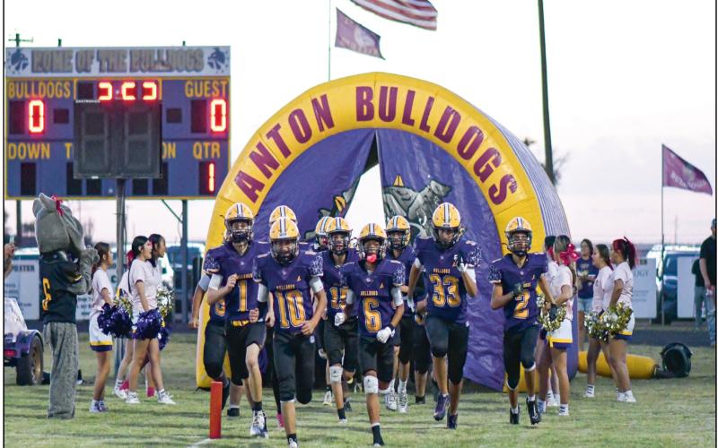 HERE COME THE BULLDOGS - The Anton Bulldogs run out of the pregame tunnel earlier before a game at Bulldog Stadium earlier this season. The Bulldogs concluded their season this past Thursday night at home against Whitharral, losing 78-0 to finish the season 3-6 overall. (Staff photo by Jentezen Smith)