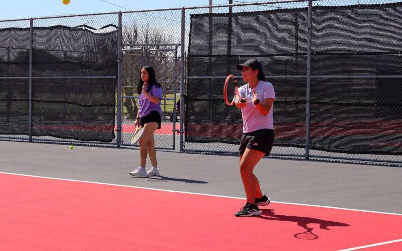 DOUBLES - Levelland athletes Daisy Perez and Alexis Sanchez were practicing their skills Wednesday during summer workouts at the Levelland High School tennis courts. (Staff Photo by Aalijah Soliz)
