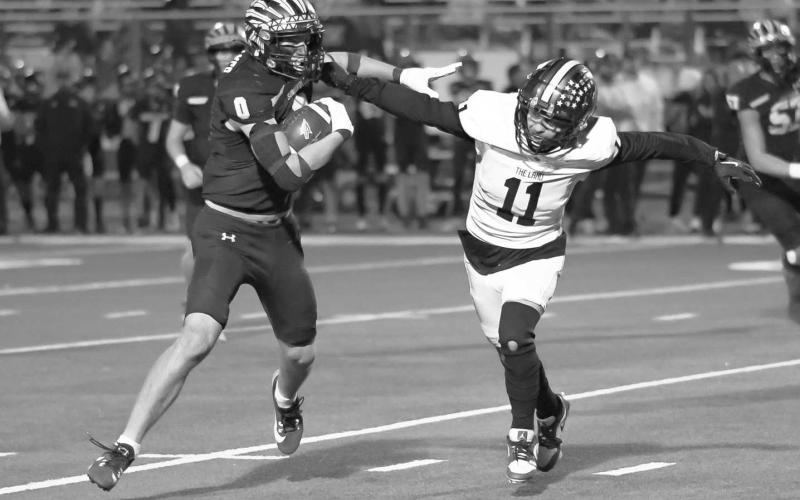 GET OVER HERE - Levelland Lobo Gage French ran down the Seminole ballcarrier this past Thursday in Denver City for the team’s playoff game. (Staff photo by Dom Puente)
