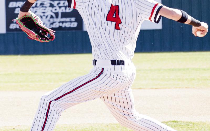 ON THE DELIVERY - Levelland Lobo Kane Rice delivers a pitch during their tournament game against Borger this past Friday at Levelland High School. (Staff photo by Eric Venkatesan)