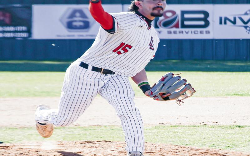PITCH RELEASE - Levelland Lobo Boston Winfield releases a pitch during their tour nament game against Borger this past Friday at Levelland High School. (Staff photo by Jentezen Smith)