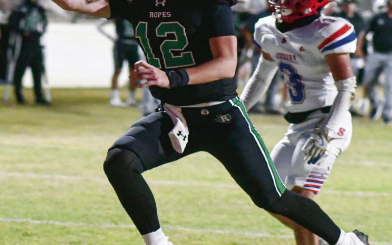 SCRAMBLE IT IN - Senior quarterback Kade Franklin evades the Sundown defense and scrambles it in for a touchdown this past Friday night at Ropes Eagle Stadium. (Staff photo by Jentezen)