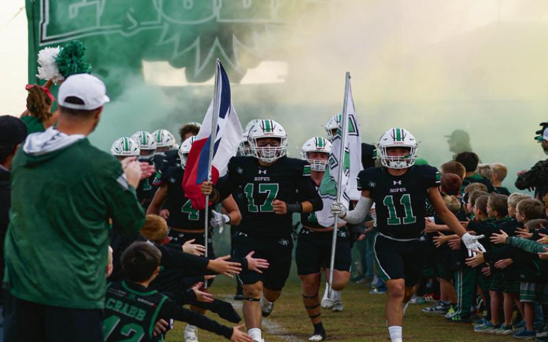 HERE COME THE EAGLES - The Ropes Eagles football team runs out before their game against Sundown this past Friday night at Ropes Eagle Stadium. They would win 54-8. (Staff photo by Jentezen Smith)