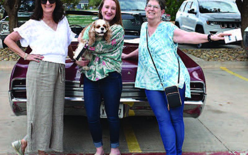 WILDCATS– Thunder on the Plains Poker Run had some wildcats on the loose Friday evening. Pictured from the left are Iris Keeling and her daughter, Alycyn Keeling with her companion, Abygail and Beth Walls, all of Levelland, heading out for the annual Poker Run and Cruise in a 1966 Wildcat GS. Iris is the owner of the 1966 Wildcat, which is one of only 200 made. (Staff Photo)