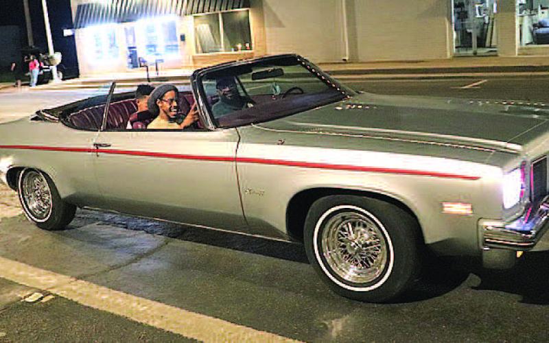 1975 OLDSMOBILE DELTA 88– Robert Whitfield and his son, Shad, and grandson, Shaydon, were looking cool cruising in their 1975 Oldsmobile Delta 88 classic car in the annual Thunder on the Plains Cruise Friday night. The cruise hosted classic cars and trucks, hot rods, street rods and rat rods from as far as Lovington, New Mexico. (Staff Photo by Shawn Franklin)