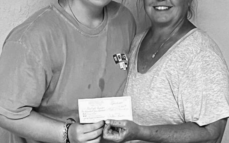 BOGGS SCHOLARSHIP - Derrick Boggs recently held a golf tournament in his father’s name Jerry as it was one of his favorite hobbies. This year was the first scholarship in his name and was given to his granddaughter, a Morton senior Kayleigh. Pictured is Kayleigh receiving a $1,500 scholarship from MGA member Stacy Ruthardt. The senior will be attending Texas Tech University in fall and will be majoring in physical therapy. (Photo courtesy of Holly Boggs)