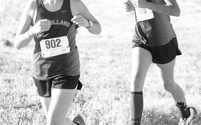 MIDDLE SCHOOL RUNNERS- The Levelland Loboette Middle School cross country team placed fourth at the Sundown Oil Patch Invitational. Pictured are Loboettes runners Avanie Lopez and Madilyn Barrientes. (Photo Courtesy of Debbie Blackshear)