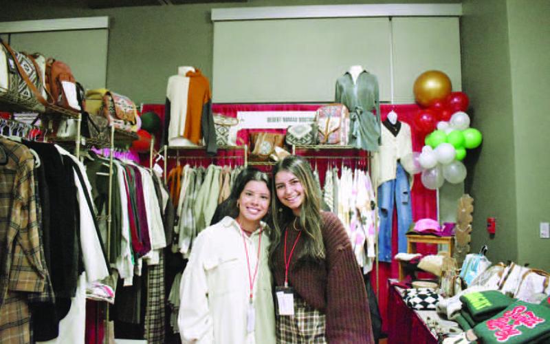 SMILES FOR FA LA LA - The Levelland Chamber of Commerce and hosted the 10th annual Fa La La event December 8, at the Mallet Event Center. Vendors were on hand to showcase their unique products and network with the ladies in attendance. The Desert Nomad Boutique was in full display as the Friona based business attended the event. (Photo Courtesy of Delany Jackson)