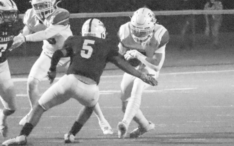 OUT OF MY WAY - Ropes running back Bregg Feldman ran over a Ralls defender in the teams loss in Abernathy last Thursday. (Staff photo by Aalijah Soliz)