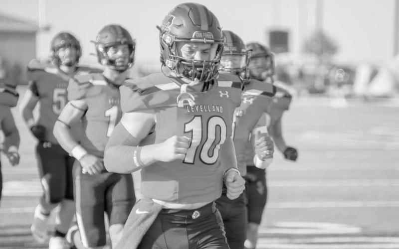 RUN OUT - The Levelland Lobos ran out of the tunnel before their opening regular season game with senior Rusty Johnson leading the way in the Lobos. The Lobos suffered their first loss at home against the Plainview Bulldogs, but looked to bounce back with their first road game against the Snyder Tigers this past Friday. (Staff photo by Dom Puente)