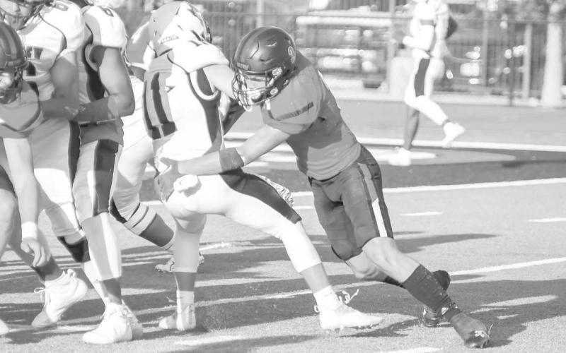 GREAT TACKLE - Senior Levelland safety Ben Alvarado made a back field tackle during last Friday’s contest against the Plainview Bulldogs in their loss. The Lobos traveled to Snyder for their second game of the season. (Staff photo by Dom Puente)