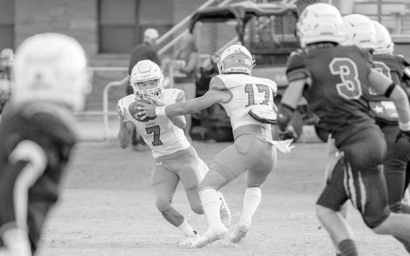 HAND OFF - Ropes quarterback Hayden Torres handed the ball off to runningback Ben Saldivar during the Eagles big win over Boys Ranch. The Eagles faced Eunice, New Mexico, this thursday as the away team. (Photo courtesy of Donovan Martin)