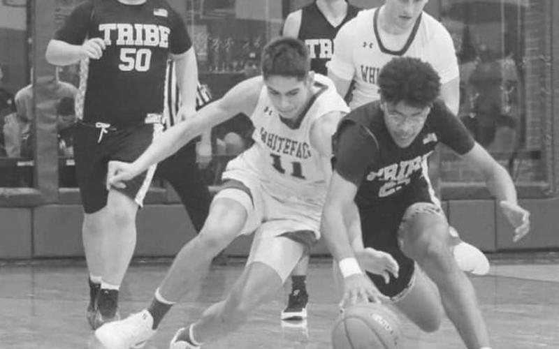 LOOSE BALL - Whiteface Antelope Cesar Chavez and Morton Indian Brayden Villarreal both dove to get to the loose ball during the team’s game against each other last Friday. (Photo courtesy of Holly Crutcher)
