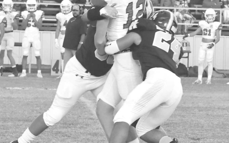 PASS RUSH - The Morton Indian defense had their work cut out for them as they were often forced to defend a short field against the Ropes Eagles last Friday. Here Christian Enriquez and Jorge Regalado sacked Ropes quarterback Kade Franklin. The Indians lost 54-6 and will travel to Smyer next Friday. Ropes will host Seagraves on Friday. Both games start at 7 p.m. (Staff photo by Jay Kelley)