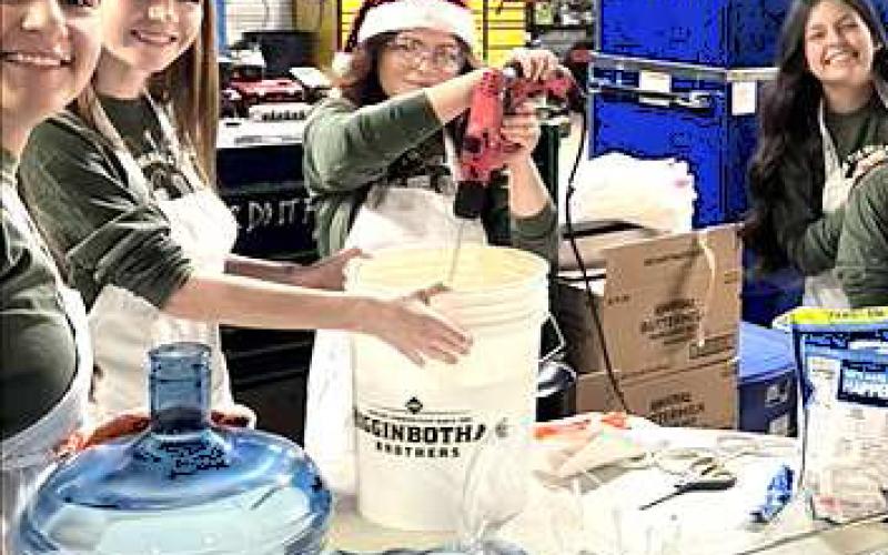 SPREADING HOLIDAY CHEER- Smith Auto Family held their 26th annual Pancake breakfast on Christmas Eve. Pictured are helpers preparing pancakes for community members to enjoy. (Smith Auto Family Levelland photo)