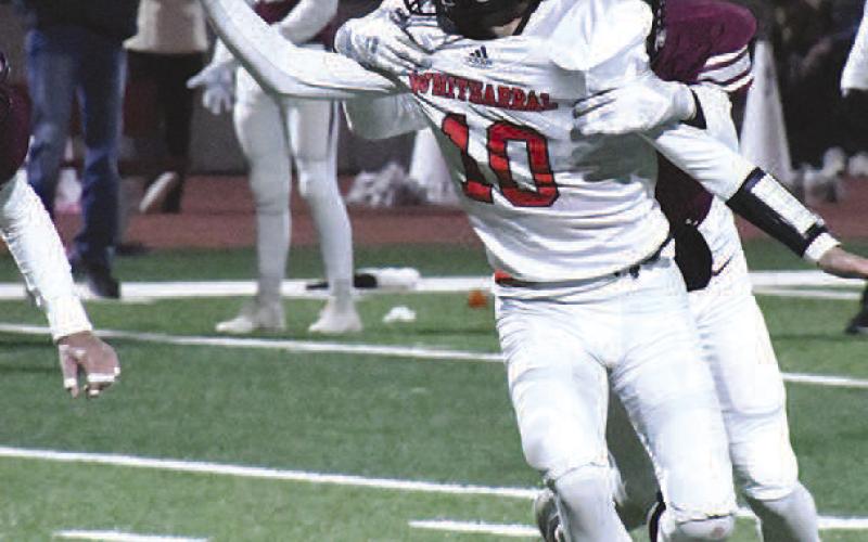 IMPROVISED PASS- Whitharral Panther QB Jeryn Ellerd improvised pass just before he was tackled. The Panthers dominated the Klondike Cougars, 64-20, Friday in Lubbock during the area round of playoffs. The Panther will be taking on the Balmorrhea Bears in Hermleigh, Friday at 6 p.m. in the regional finals. (Staff Photo by Dom Puente)