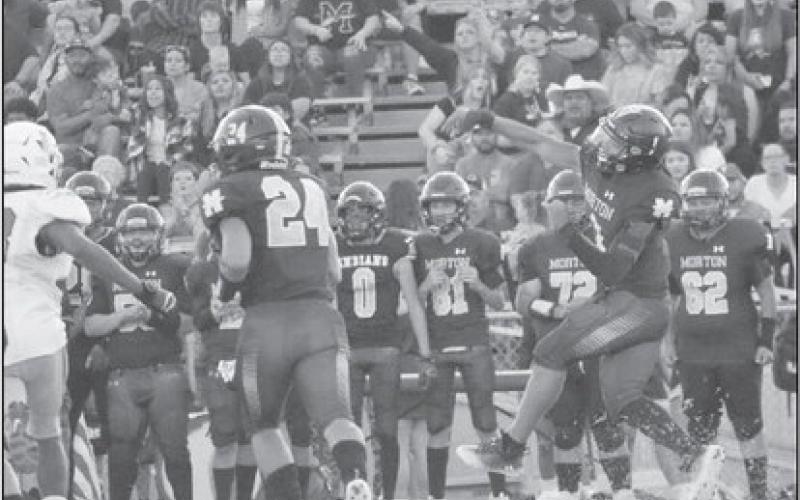 THROW ON THE RUN - Morton quarterback Dante Chavez was on the move making a good pass to his receivers during the teams loss on homecoming. (Staff photo by Aalijah Soliz)