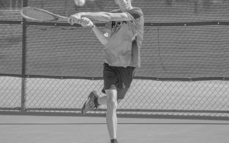 STRONG FOLLOW THROUGH - Levelland Lobo Ryeton McMahan competed in a doubles match at home against the Sweetwater Mustang Tennis Team on Tuesday. The Lobo Pack hit the courts on the road against Liberty High School on Saturday. (Staff photo by Dom Puente)