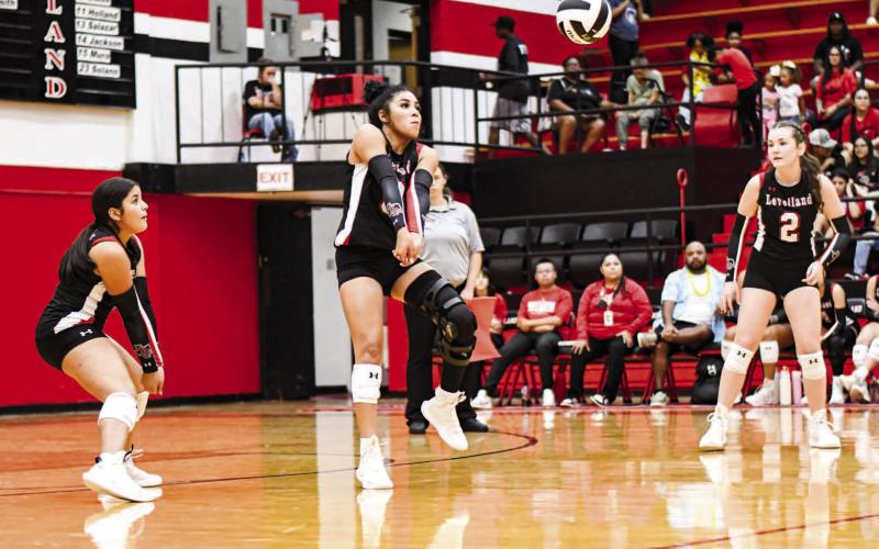 KEEP IT ALIVE – Junior Mia Sepulbeda gets her arms set under the volleyball to keep it in play while her teammates watch during a match at home against Abernathy this past Tuesday. (Staff photo by Jentezen Smith)