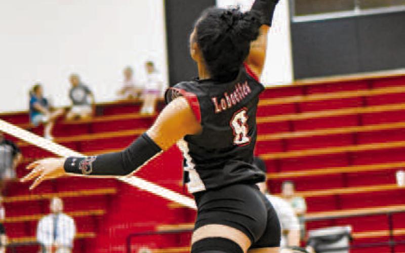 TAKE FLIGHT– Junior Mia Sepulbeda gets air while going for the spike during a match at home against Abernathy. (Staff photo by Jentezen Smith)