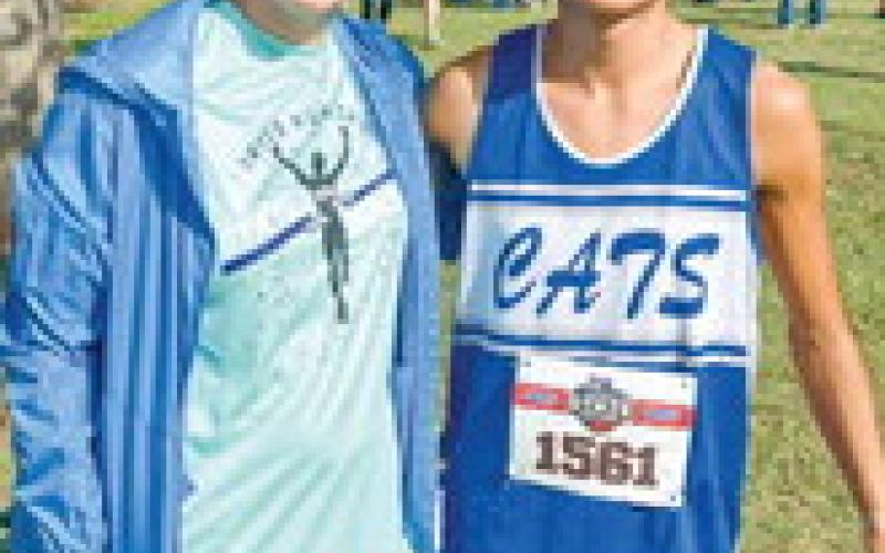 REPPIN’ FOR THE CATS - Smyer Cross Country Head Coach Shelby Binion and senior Ismael Pizano pose for a photo at the the 2A UIL Cross Country State Championship on Nov. 1 in Round Rock, Texas. Pizano would earn All-State honors. (Provided by Smyer ISD Facebook)