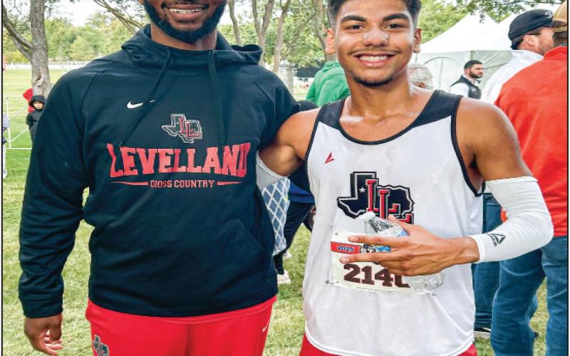 19TH AT STATE - Levelland Cross Country Head Coach Justin Turner and junior Saul Hernandez pose for a photo at the 4A UIL Cross Country State Championship on Nov. 1 in Round Rock, Texas. Hernandez would run a 16:11.50 in the boy’s 5K race to finish 19th overall in the meet. (Provided by Justin Turner)