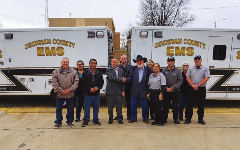 NEW ADDITIONS - The Cochran County Commissioners Court and Frontier Ambulance Corporation are pictured in front of the two new F550 Type 1 Units that will service the Cochran community. Before their regular meeting Thursday morning, the court and Morton EMS took a walk around the new units. Contracted with the city of Morton, Frontier Ambulance will be aiding the city in servicing the two new units moving forward. (Staff Photo)