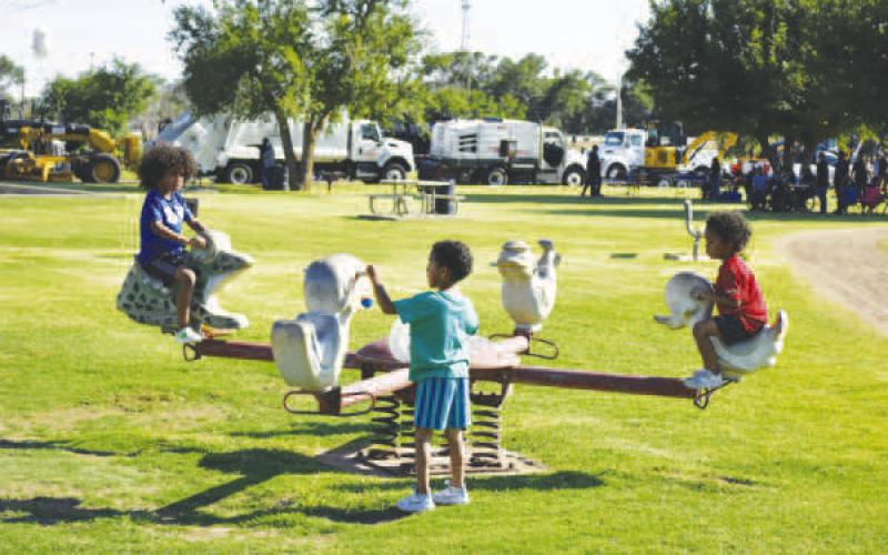 PLAYING TOGETHER – Pictured are kids playing at L.B. Griffin park this past Friday during the Juneteenth celebration. The event had a move night, kid’s games and a basketball tournament over the weekend. (Staff photo)