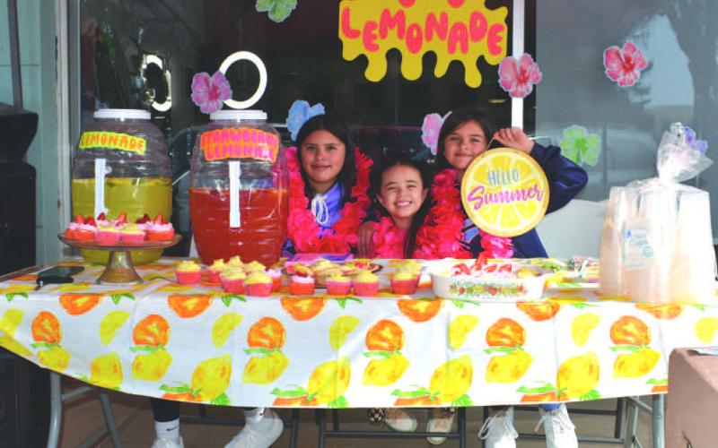 LULU LEMONADE- On Saturday, Lulu Lemonade participated in Lemonade Day even on the square . Pictured in no particular order are: Jocelhyn Marrufo and Jazmin Marrufo who play youth softball and Ixtli Sanchez who dances for the Levelland Dance Studio. (Staff photo by Emily Campos)