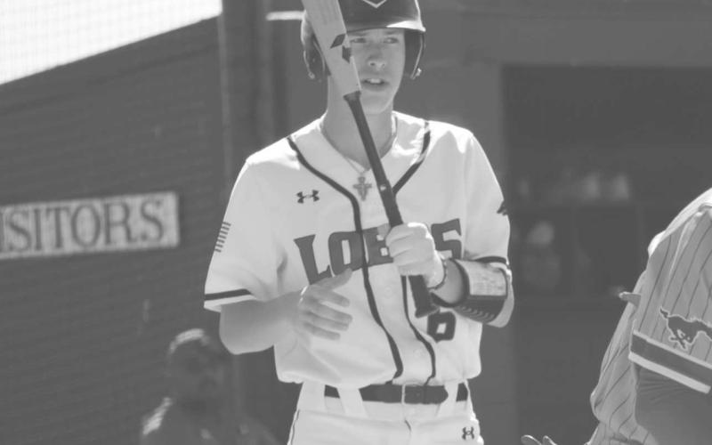 TAKE A BREATHER - Levelland Lobo Anson Mcmahan took a breather before his at bat during their last matchup last Tuesday against the Denver City Mustangs. (Staff photo by Aalijah Soliz)