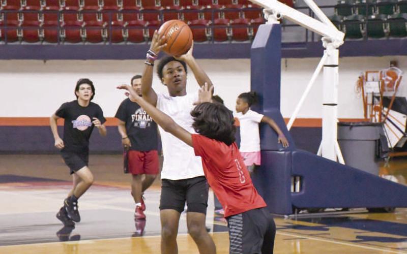 PULL UP- Levelland Lobo eighth-grader Bryson Golightly pulled up for a jumper during the 2023 Levelland Basketball Camp at South Plains College. (Staff Photo by Dom Puente)