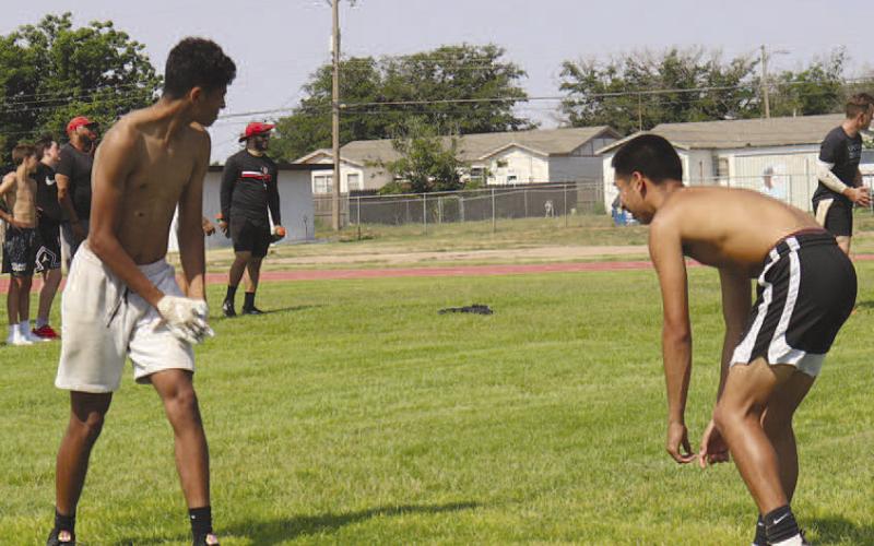 FACE OFF- Pictured are Levelland’s Ezekiel Arias and Zeke Martinez going against each other during team summer league workouts. The Lobos will be in Lubbock Monday for seven-on-seven action. The first game will be at Lubbock High at 6 p.m., June 26. (Staff Photo by Aalijah Soliz)