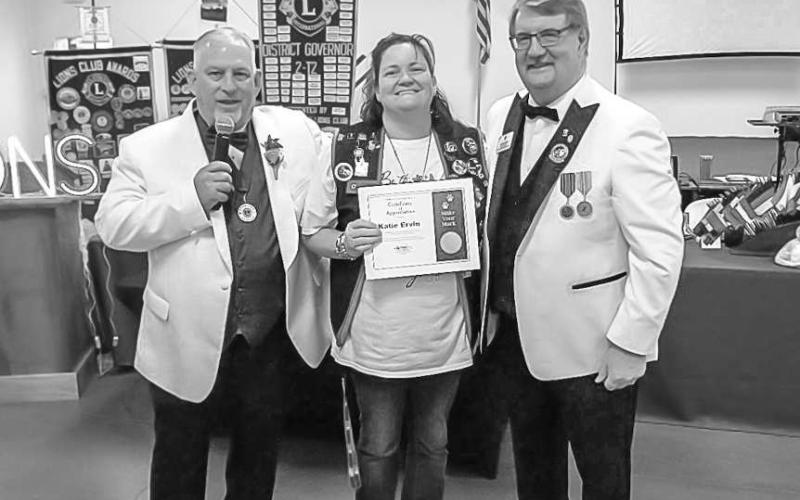 HONOR BEFITTING A LION - On Saturday May 10, Katie Ervin of the Levelland Evening Lions Club was honored with the fourth highest award that can be given to a Lion. A certificate of Appreciation: in recognition of distinguished achievements in Fulfilling the Mission of Lions Club International, signed from the International President of Fabricio Oliveira (2024-2025). Pictured from left to right at the presentation are: Jake Bentley District Governor for District 2T2 (2024-2025), Katie Ervin Secretary/Treasur