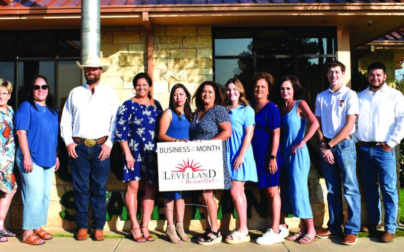 JULY BUISINESS OF THE MONTH - Sundown State Bank was selected for the Businesss of the Month award for July. The monthly contest is held by the Chamber of Commerce and Keep Levelland Beautiful Program. Pictured from left to right is: Kelly Hancock, Barbra Pinner, Janie Morales, Chad Currington, Lisa Delgado, Tiffany Torres, Roberta Garza, Ella McCormick, Kim Smith, Christi Spruiell, Mark Buxkemper, Jonathon Sainz and Donna Wheeler. Not pictured is Kirk Alexander. (Photo courtesy of Emily Campos)