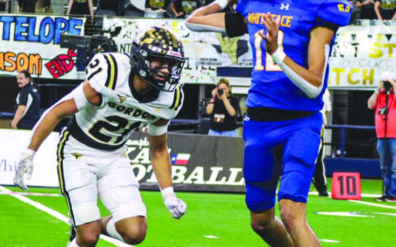 CALM UNDER PRESSURE - Whiteface Antelope Isaak Soliz threw a good pass to his receiver while under pressure during the team’s last game of the season in the state championship against the Gordon Longhorns, Wednesday at Jones AT&amp;amp;T Stadium. (Staff photo by Aalijah Soliz)
