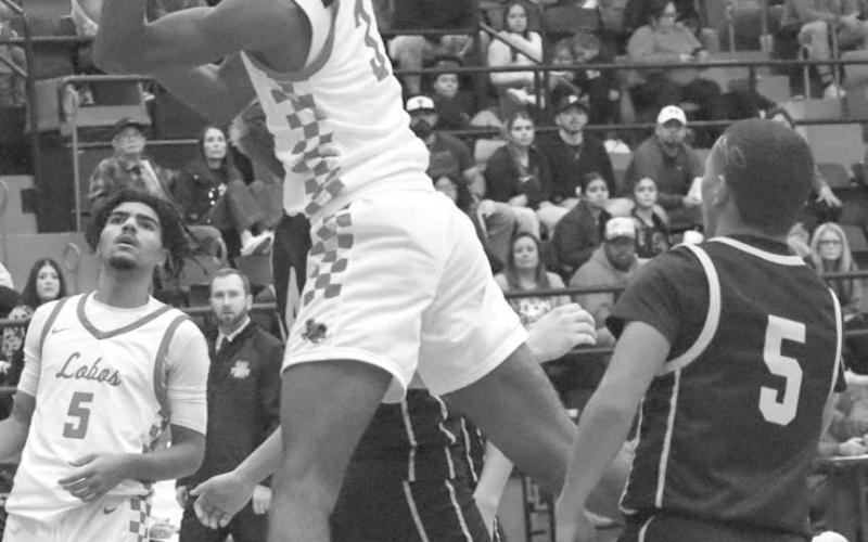 HIGH FLYING - Levelland Lobo Eryk Jones made the tough layup during the teams contest against the Snyder Tigers this past Friday in district basketball play. (Staff photo by Aalijah Soliz)