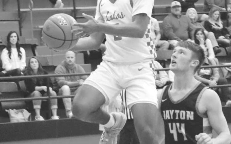 LAY UP - Levelland Lobo Jayden Castillo broke off for a Levelland fast-break to get the team some much needed points throughout the game. Castillo led the team in scoring by getting them 22 points in the teams loss against Jayton. (Staff photo by Aalijah Soliz)