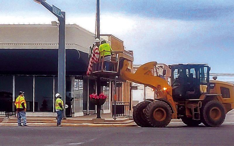 HOLIDAY WRAP-UP - City of Levelland crews were scene taking down the lighted Christmas decorations that placed on various light poles through the busy roadways such as College Avenue and Avenue H. (Staff photo by Emily Campos)