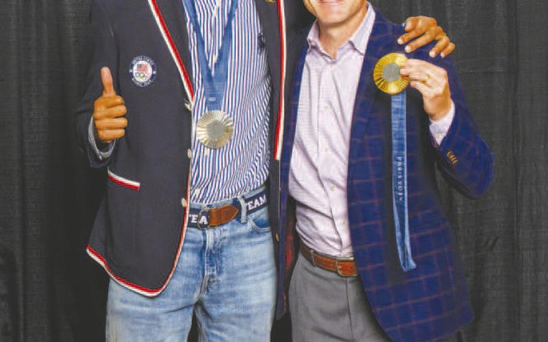 DISTINGUISHED ALUMNI AWARD WINNER - Vernon Norwood (left), gold medalist in the men’s 4x400-meter relay during the 2024 Summer Olympics, received the South Plains College Distinguished Alumni Award during the college’s annual Scholarship Banquet on Nov. 7 at the Mallet Event Center in Levelland. Former SPC Assistant Track and Field Coach Blaine Wiley (right) was among the attendees who celebrated Norwood. (SPC Photo)