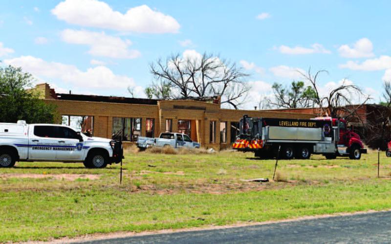 BRUSH FIRE - Levelland fire department and Hockley County Emergency Management responded to a fire at the old school in Petit Tuesday, May 16. Personnel believe the fire was started by wind blowing a nearby brush burn that had been put out. Arson and fire negligence are not suspected to be the cause of the fire. (Staff Photo by Victoria Byrnes)