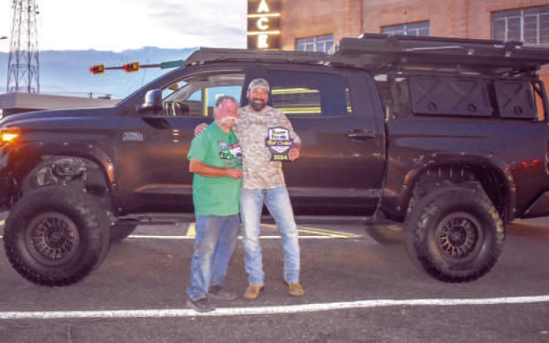 1968 TOYOTA TUNDRA- Pictured is Chad Craddock, the proud owner of this 1968 Toyota Tundra who received one of the Best Crusier awards from Darrell Bush on the cruise Friday evening. (Photo courtesy of Emily Campos)