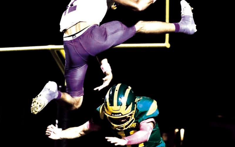 A Whiteface Antelopes’ offensive ball carrier clears a Springlake tackler to get into the end zone.