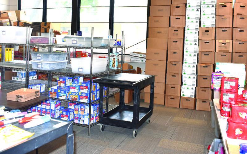 FOOD DONATIONS – Pictured are food donations for Bill’s Backpacks. The nonprofit collects, organizes, and distributes food to children in need at LISD campuses. (Staff Photo by Ada Niederhauser)