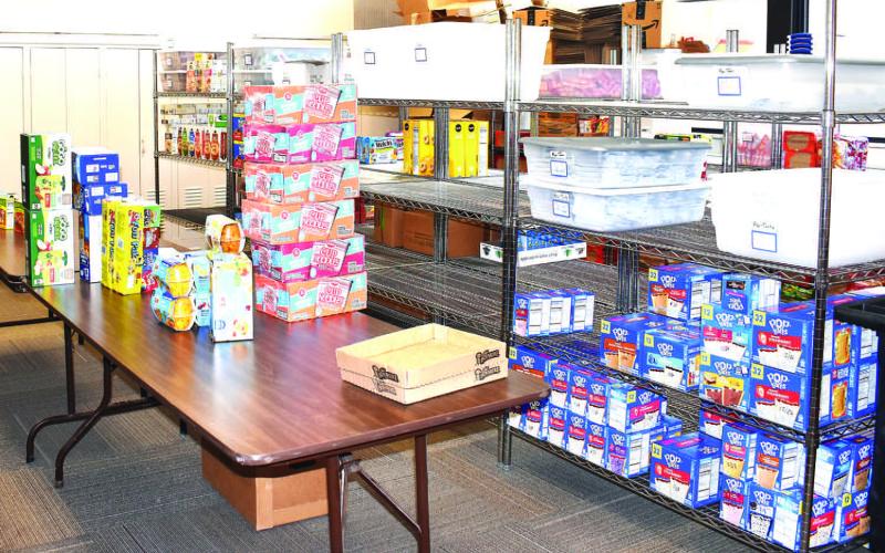 BILL’S BACKPACKS– Pictured is a storage room for Bill’s Backpacks donations. Community members and businesses donate food items and boxes to help local children in need. (Staff photo by Ada Niederhauser)