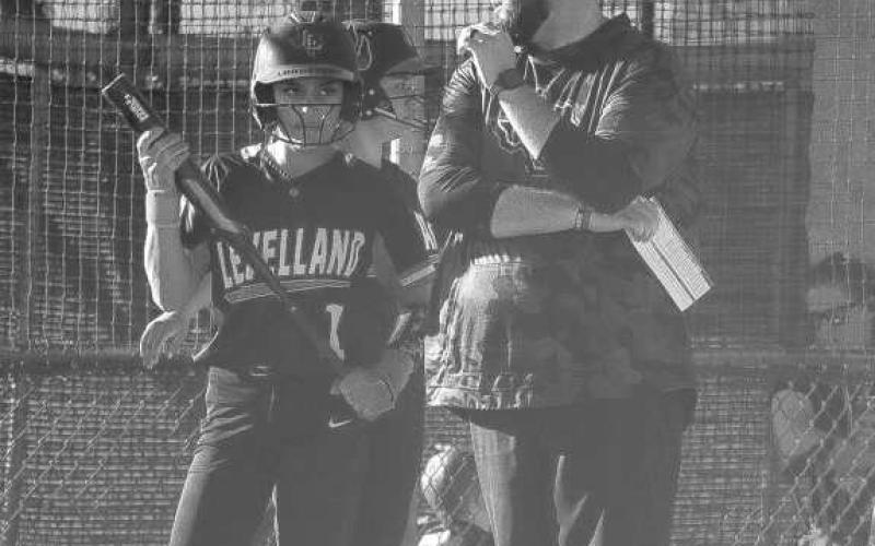 CONFIDENCE - Levelland Loboette Saydi Mendez talked with Head Softball Coach Ryan Miller during the team’s game against Plainview this past Tuesday at home. (Staff photo by Aalijah Soliz)