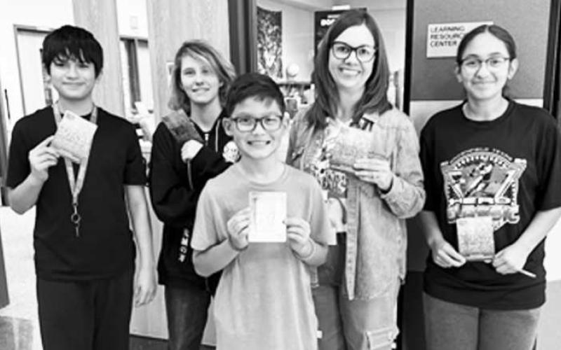READING PAYS OFF - LMS Librarian Mixie Cloweawarded five students with gift cards for exceeding in the BeanStack Reading Program. Eddie Palomino, Myrcea Barber (not pictured), and Brian Ramirez were awarded gift cards for earning the most badges. Rose Whitmire earned the Best Book Reviews gift card. Jocelyn Arriaga's was the LMS Reader drawn from all the names of those who participated in reading the first nine weeks. (Photo courtesy of Levelland ISD)