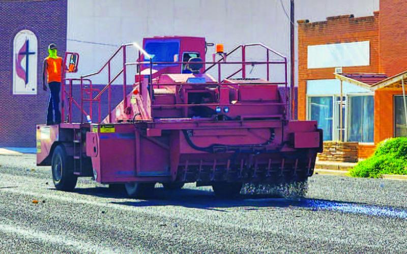 HOUSTON STREET - Hockley County Texas Department of Transportation crews worked on seal coating Houston Street throughout the week. Crews began the project by working on West Avenue leading up to Highway 114 before following down Houston Street to College Avenue. TxDOT crews have been working through various parts of Hockley County seal coating roads through the month of July into August. (Staff photo by Dom Puente)
