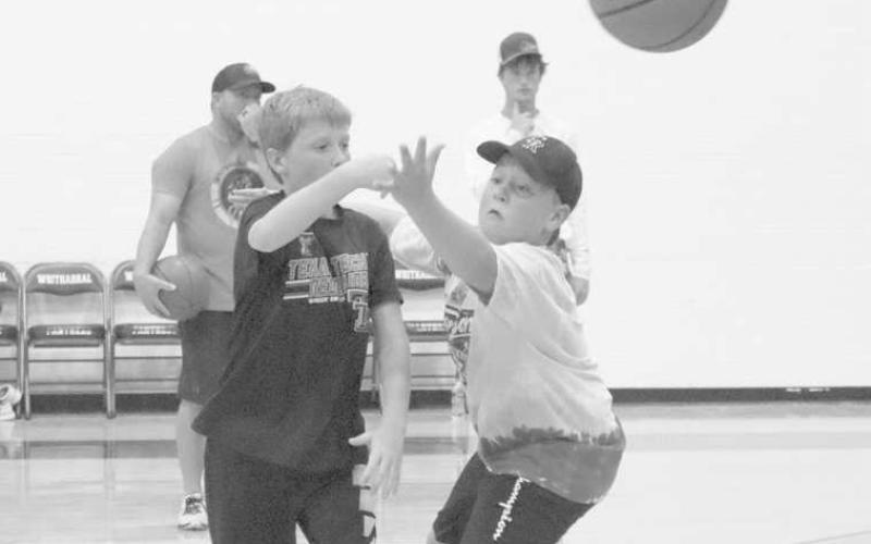 GOOD PASS - Whitharral students Westin Thompson and Caden Bates were working on their passes during the Whitharral All-Sports Camp. (Staff Photo by Aalijah Soliz)