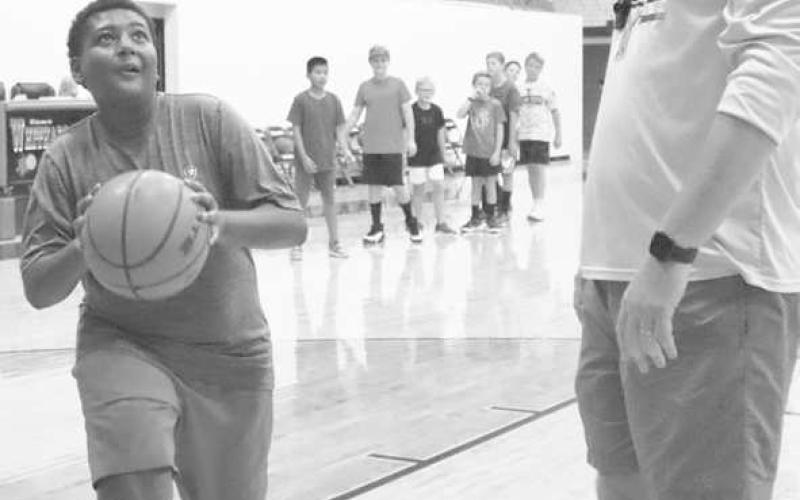 STRONG FINISH - Whitharral student Brashon Robinson finished strong againt Coach White. (Staff Photo by Aalijah Soliz)
