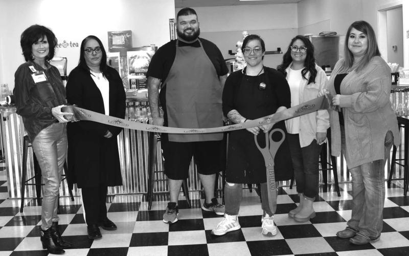 LOBO DEN RIBBON CUTTING - The Levelland Chamber of Commerce hosted a ribbon cutting to celebrate the grand opening of the Lobo Den located at 219 Cactus. Pictured from left to right are: Cristal Issacks, Janie Mireles, Derick Oavtbort, Owner Janie Oravtbort, Tiffany Olivares and Stephanie Rodriguez (Staff photo by Emily Campos)